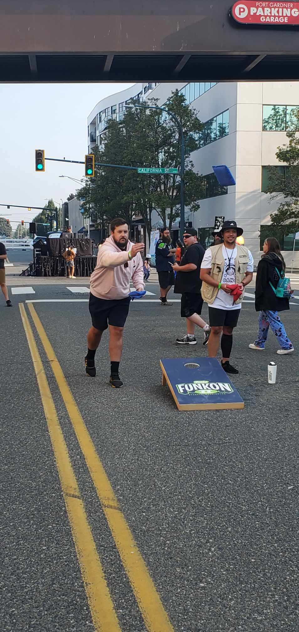 Corn Hole Toss: Funatics try their hand at tossing bean bags into targets on the street.
